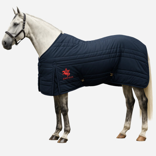 Horse wearing a navy blue quilted blanket with a visible brand logo on a white background