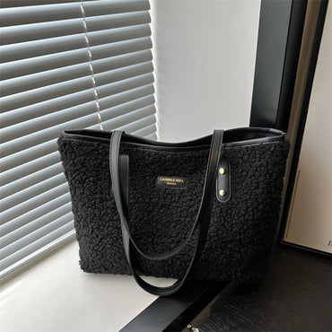 Black plush tote shoulder bag with long shoulder straps