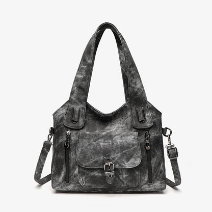 Gray handbag with black accents on a white background