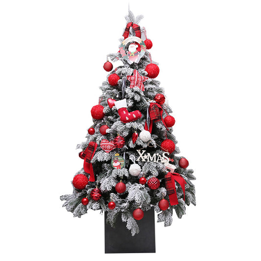 Decorated Christmas tree with red and white ornaments on a white background