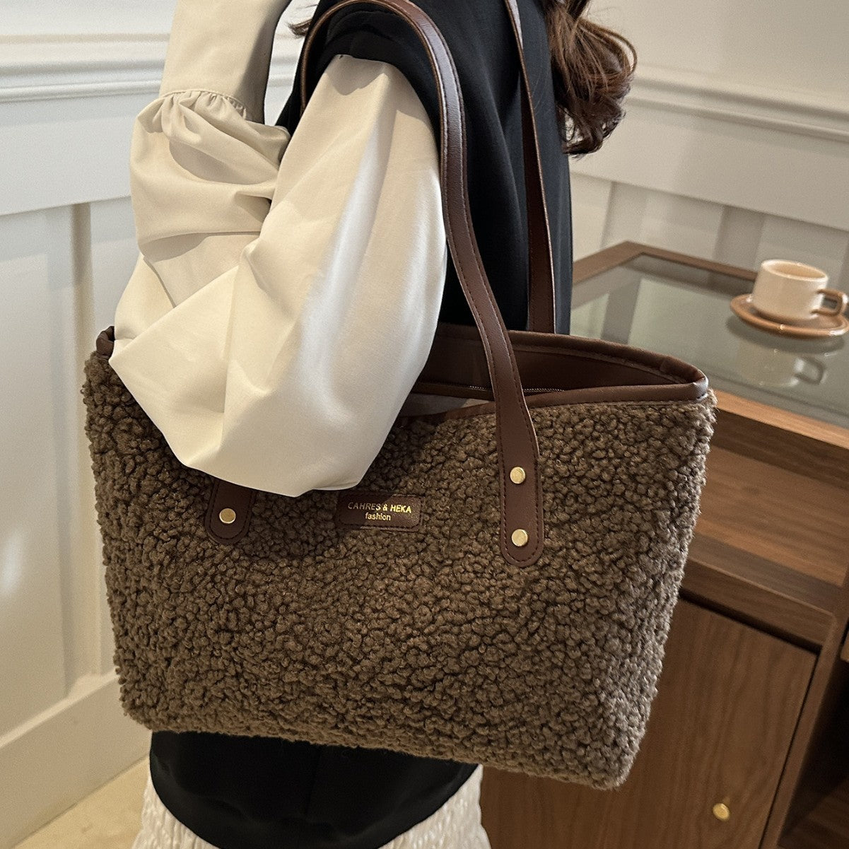 Woman carrying a coffee plush tote shoulder bag