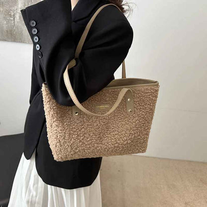 Woman carrying a khaki plush tote shoulder bag