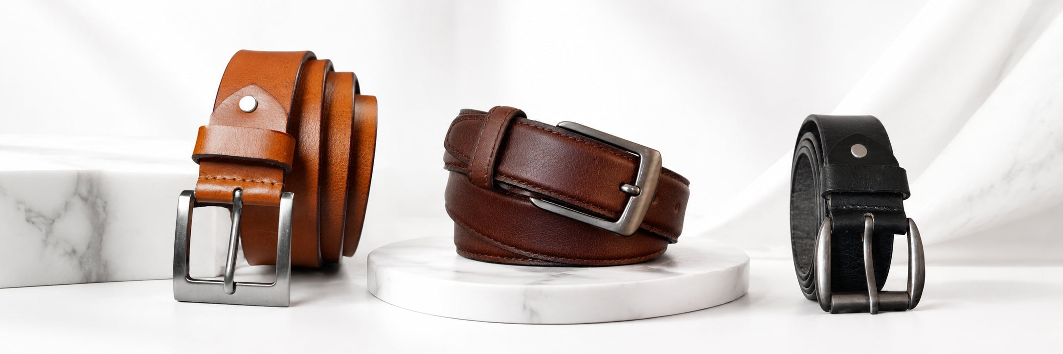 Men's leather belt collection featuring premium full grain leather belts in black and brown with durable metal buckles, handcrafted construction, and timeless styles for casual, business, and formal wear.