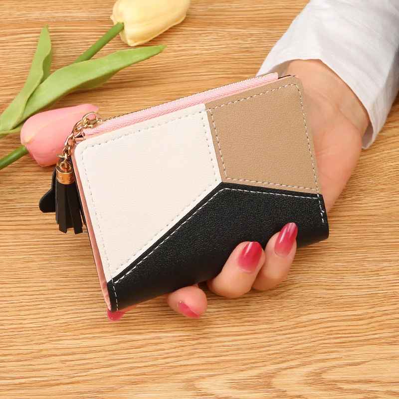 Black women's patchwork zip wallet with tassel zipper pull hand